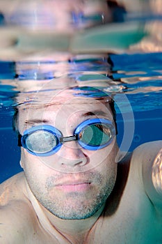Male swimmer as seen underwater
