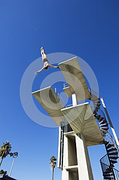Male Swimmer Diving In Midair photo