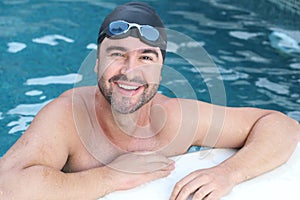 Male swimmer smiling at camera