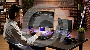 Male system hacker coding security program on pc software