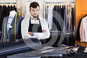 Male tailor posing in workshop