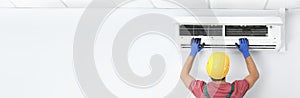 Male technician checking air conditioner , space for text. Banner design