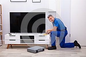 Technician Checking Television