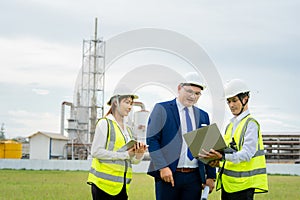 Male technician explaining work to manager and secretary