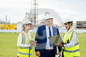 Male technician explaining work to manager and secretary