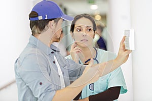 male technician fixing device in hospital