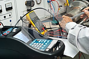 Male Technician fixing electric panel