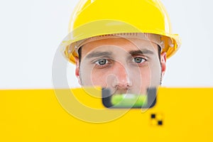 Male technician using spirit level