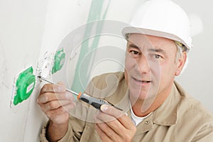 male technician at work with socket