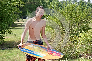 Male Teen Skimboard