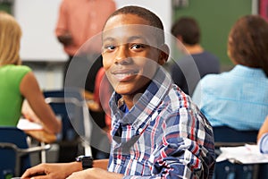 Male Teenage Pupil In Classroom