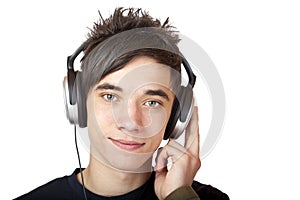 Male Teenager listening to music and smiles happy