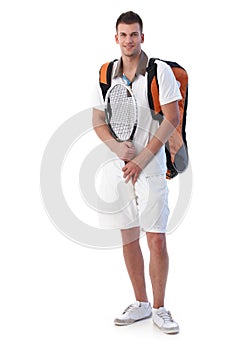 Male tennis player going for training smiling