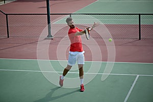 Male tennis player practice in tennis court