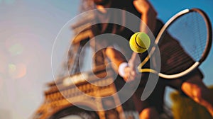 A male tennis player serves tennis ball, against the soft background of the Eiffel Tower, Summer Olympics in Paris