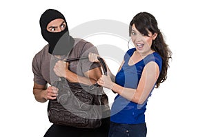 Male thief robbing beautiful young girl photo