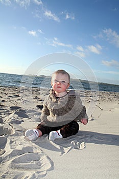 Male toddler playing on beach