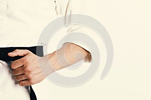 Male torso and sportive arms on white background