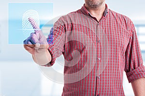 Male touching modern button for fingerprint scan