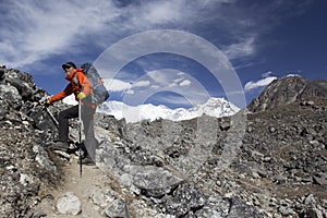 Male tourist with a backpack in the mountains. Himalayas, Nepal