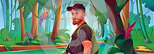 Male tourist with backpack walking in jungle