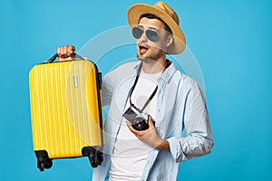 Male tourist with camera luggage passenger airport