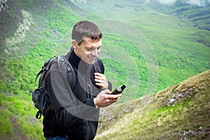 Male tourist holding GPS