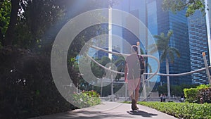 Male tourist walking by downtown of a modern city