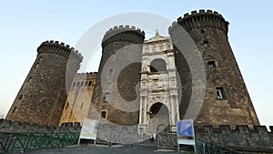 Male tourist walking to beautiful medieval Maschio Angioino castle in Naples