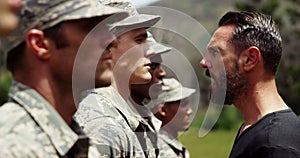 Male trainer training military troops 4k