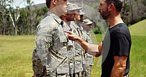 Male trainer training military troops 4k