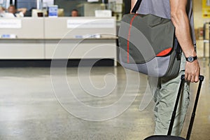 Male Traveler With Luggage In Lobby