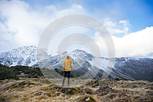 A male traveller enjoying a breath taking view of mountain region.