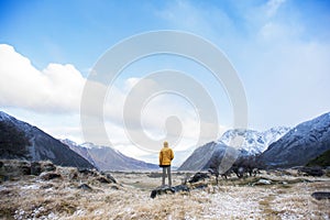 A male traveller enjoying a breath taking view of mountain region.