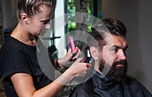 male trendy hairdo. perfect haircut with blade razor. barber master cut hair. mature hipster with beard at hairdresser