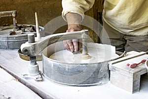 Male using a grind stone