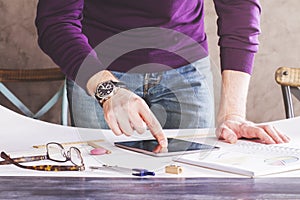 Male using tablet on whatman