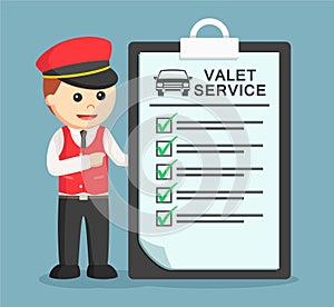 Male valet service standing with valet service list