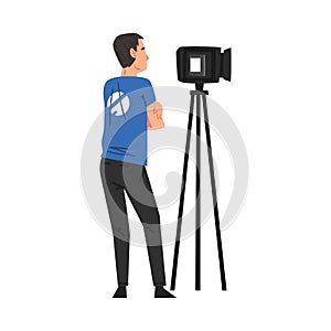 Male Video Operator Looking Through Professional Camcorder on Tripod, Television Industry Concept Cartoon Style Vector
