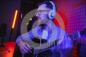 Male vlogger recording music related broadcast at studio