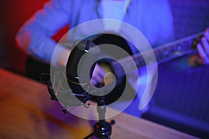 Male vlogger recording music related broadcast at studio