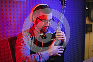 Male vlogger recording music related broadcast at studio