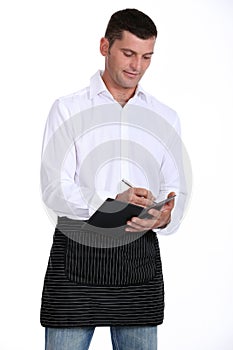 Male waiter taking order