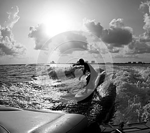 Male Wake surfs in the sea