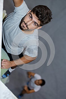 Male wall climber on top