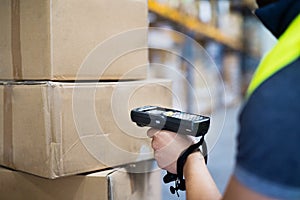 Male warehouse worker with barcode scanner. photo