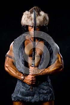 Male warrior with sword raised.