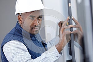 male window fitter adjusting glass
