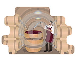 Male winemaker checks wine during fermentation process in large wooden vat at wine cellar with oak barrels