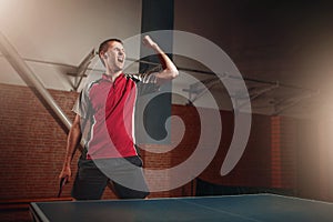 Male winner with racket, table tennis